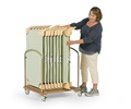 A teacher is storing Cots on a Cot Cart