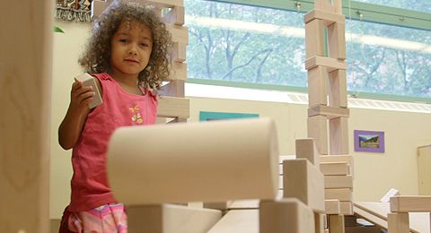 girl stacking blocks