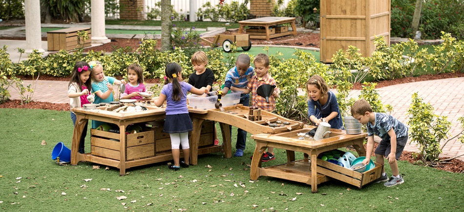 preschool kids playing with a sand and water table