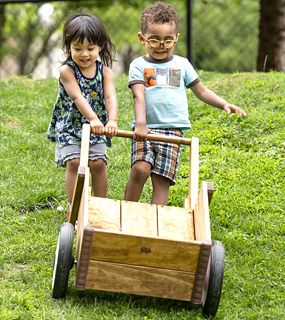 two children with a wheelbarrow